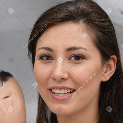 Joyful white young-adult female with long  brown hair and brown eyes