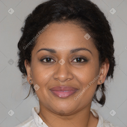 Joyful black adult female with medium  brown hair and brown eyes