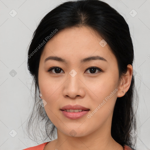 Joyful asian young-adult female with medium  brown hair and brown eyes