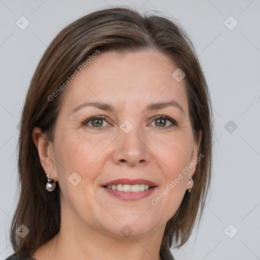 Joyful white adult female with medium  brown hair and grey eyes