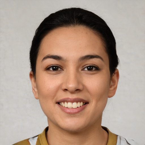 Joyful white young-adult female with short  brown hair and brown eyes