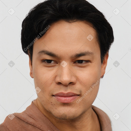 Joyful asian young-adult male with short  brown hair and brown eyes