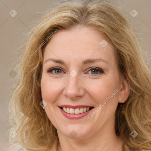 Joyful white adult female with long  brown hair and brown eyes