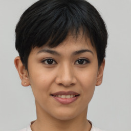 Joyful asian young-adult female with short  brown hair and brown eyes