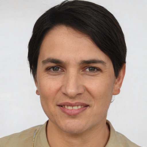 Joyful white adult male with short  brown hair and brown eyes