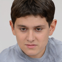 Joyful white child male with short  brown hair and brown eyes