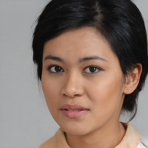 Neutral asian young-adult female with medium  black hair and brown eyes