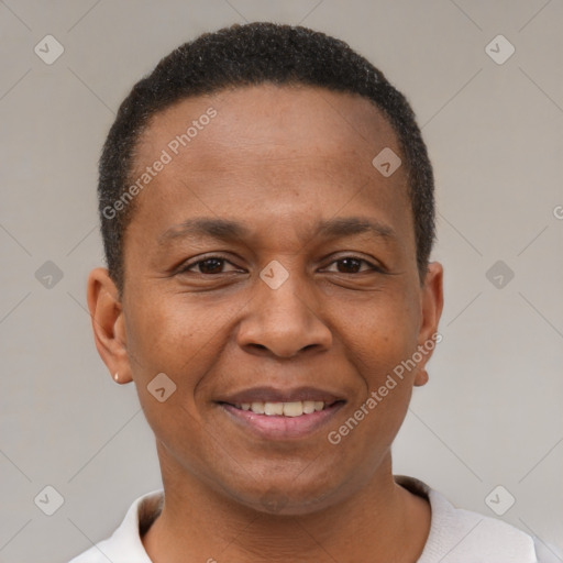 Joyful black adult male with short  brown hair and brown eyes