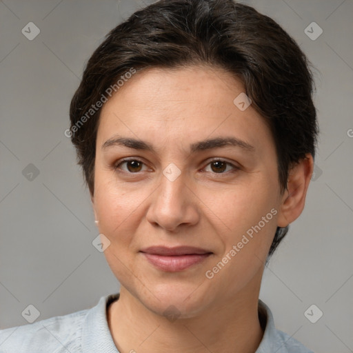 Joyful white adult female with short  brown hair and brown eyes