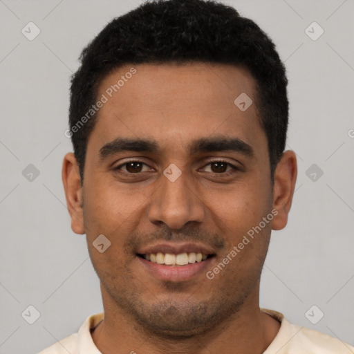 Joyful latino young-adult male with short  black hair and brown eyes