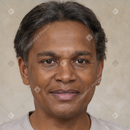 Joyful black adult male with short  brown hair and brown eyes