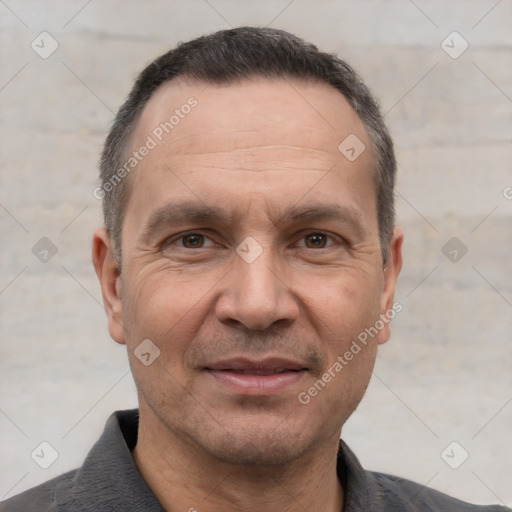 Joyful white adult male with short  brown hair and brown eyes