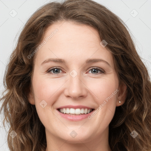 Joyful white young-adult female with long  brown hair and green eyes