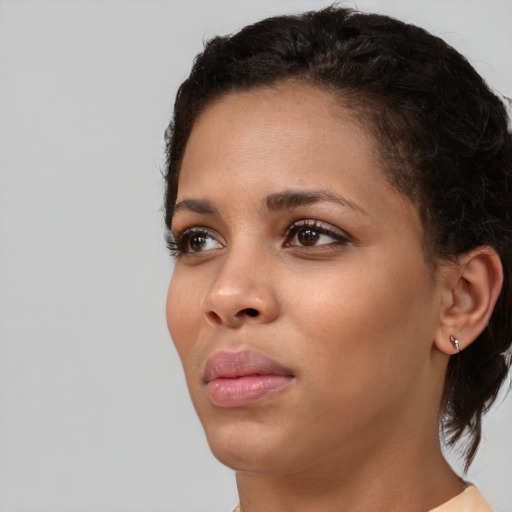 Neutral black young-adult female with short  brown hair and brown eyes