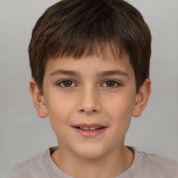 Joyful white child male with short  brown hair and brown eyes