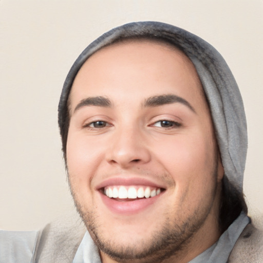 Joyful white young-adult male with short  black hair and brown eyes