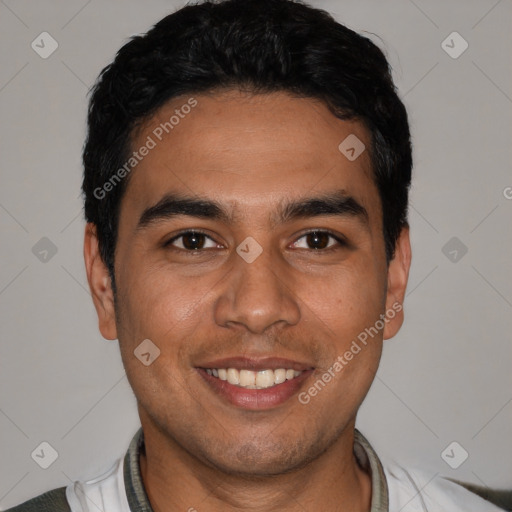 Joyful white young-adult male with short  black hair and brown eyes