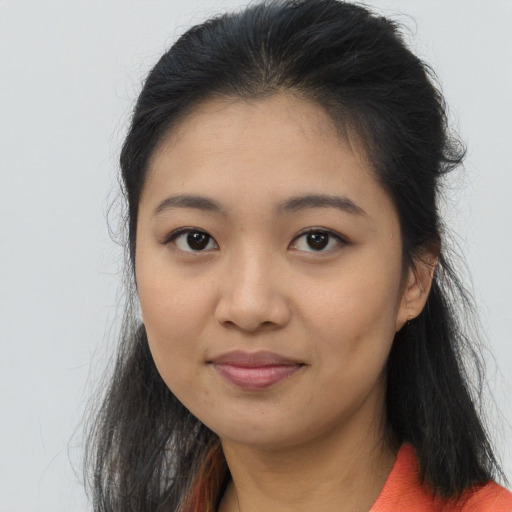Joyful asian young-adult female with long  brown hair and brown eyes