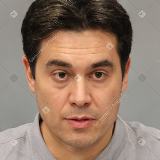 Joyful white adult male with short  brown hair and brown eyes