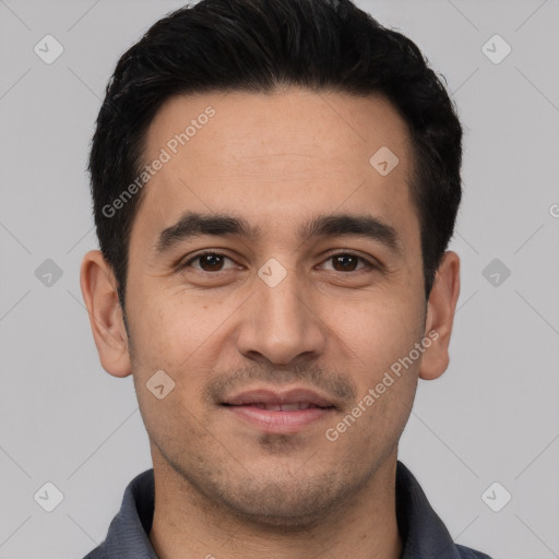 Joyful white young-adult male with short  black hair and brown eyes