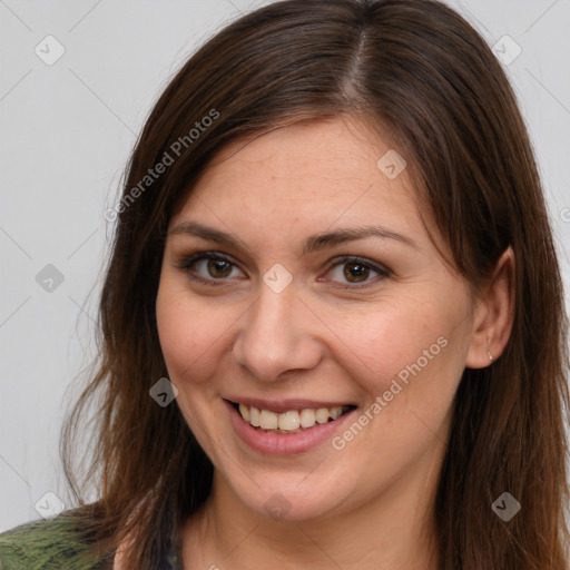 Joyful white young-adult female with long  brown hair and brown eyes