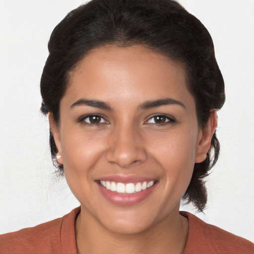 Joyful white young-adult female with medium  brown hair and brown eyes