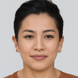 Joyful asian young-adult female with short  brown hair and brown eyes