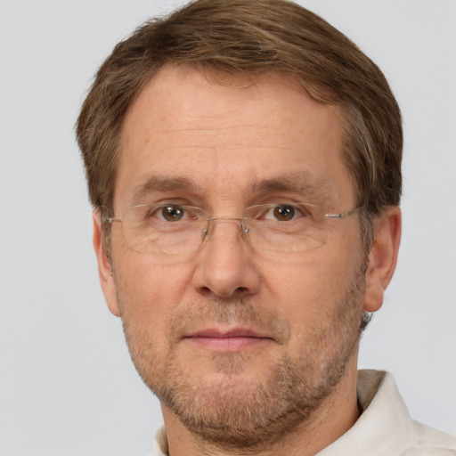 Joyful white adult male with short  brown hair and grey eyes