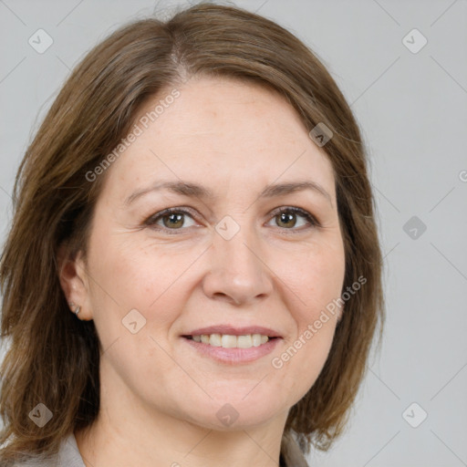 Joyful white adult female with medium  brown hair and grey eyes