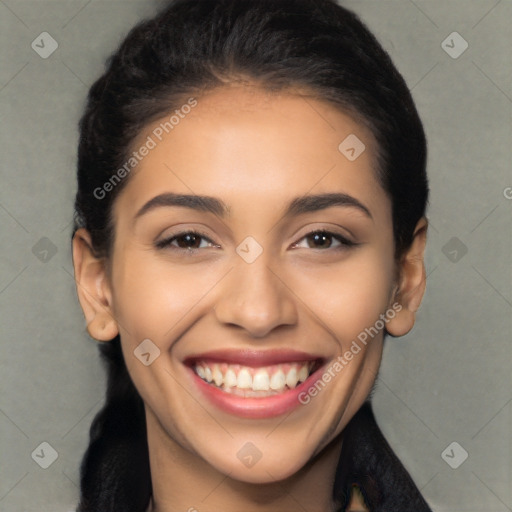 Joyful latino young-adult female with long  black hair and brown eyes