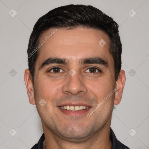 Joyful white young-adult male with short  black hair and brown eyes