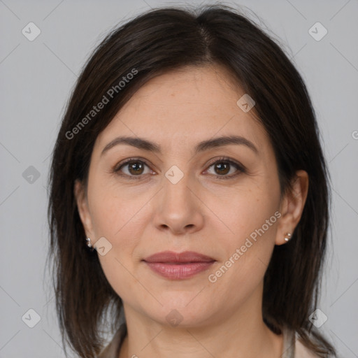 Joyful white adult female with medium  brown hair and brown eyes