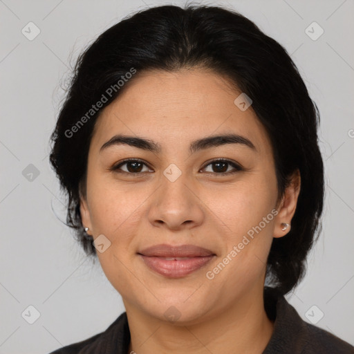 Joyful latino adult female with medium  brown hair and brown eyes