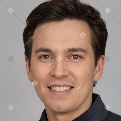 Joyful white adult male with short  brown hair and brown eyes