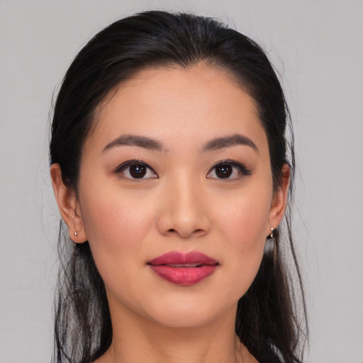 Joyful asian young-adult female with medium  black hair and brown eyes