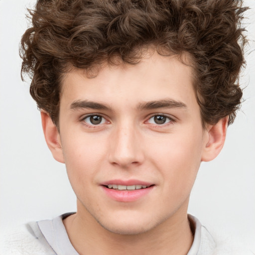 Joyful white child male with short  brown hair and brown eyes