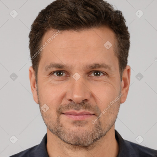 Joyful white adult male with short  brown hair and brown eyes