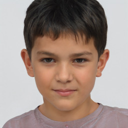 Joyful white child male with short  brown hair and brown eyes