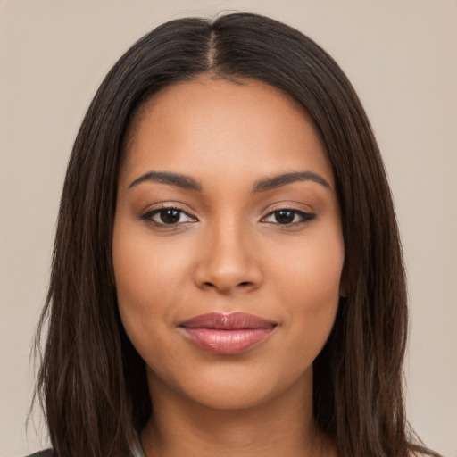 Joyful latino young-adult female with long  brown hair and brown eyes