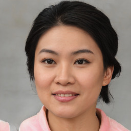 Joyful asian young-adult female with medium  brown hair and brown eyes