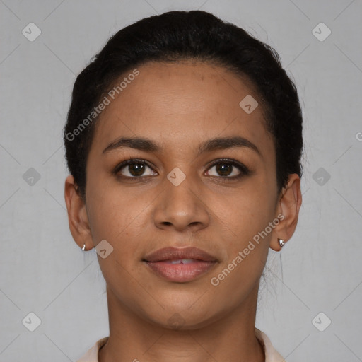 Joyful latino young-adult female with short  black hair and brown eyes