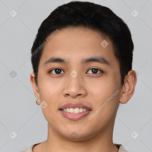 Joyful asian young-adult male with short  black hair and brown eyes