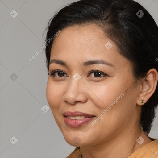 Joyful white adult female with medium  brown hair and brown eyes