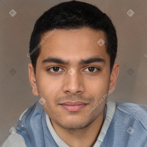 Joyful latino young-adult male with short  brown hair and brown eyes