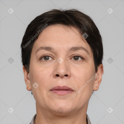 Joyful white adult female with short  brown hair and brown eyes