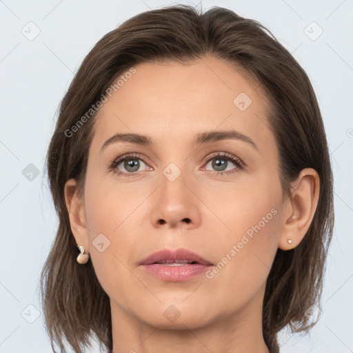 Joyful white young-adult female with medium  brown hair and grey eyes