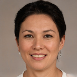 Joyful white adult female with short  brown hair and brown eyes