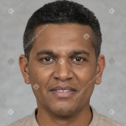 Joyful black young-adult male with short  brown hair and brown eyes