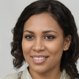 Joyful black young-adult female with medium  brown hair and brown eyes