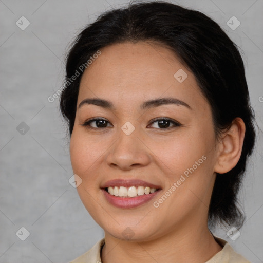 Joyful latino young-adult female with medium  brown hair and brown eyes